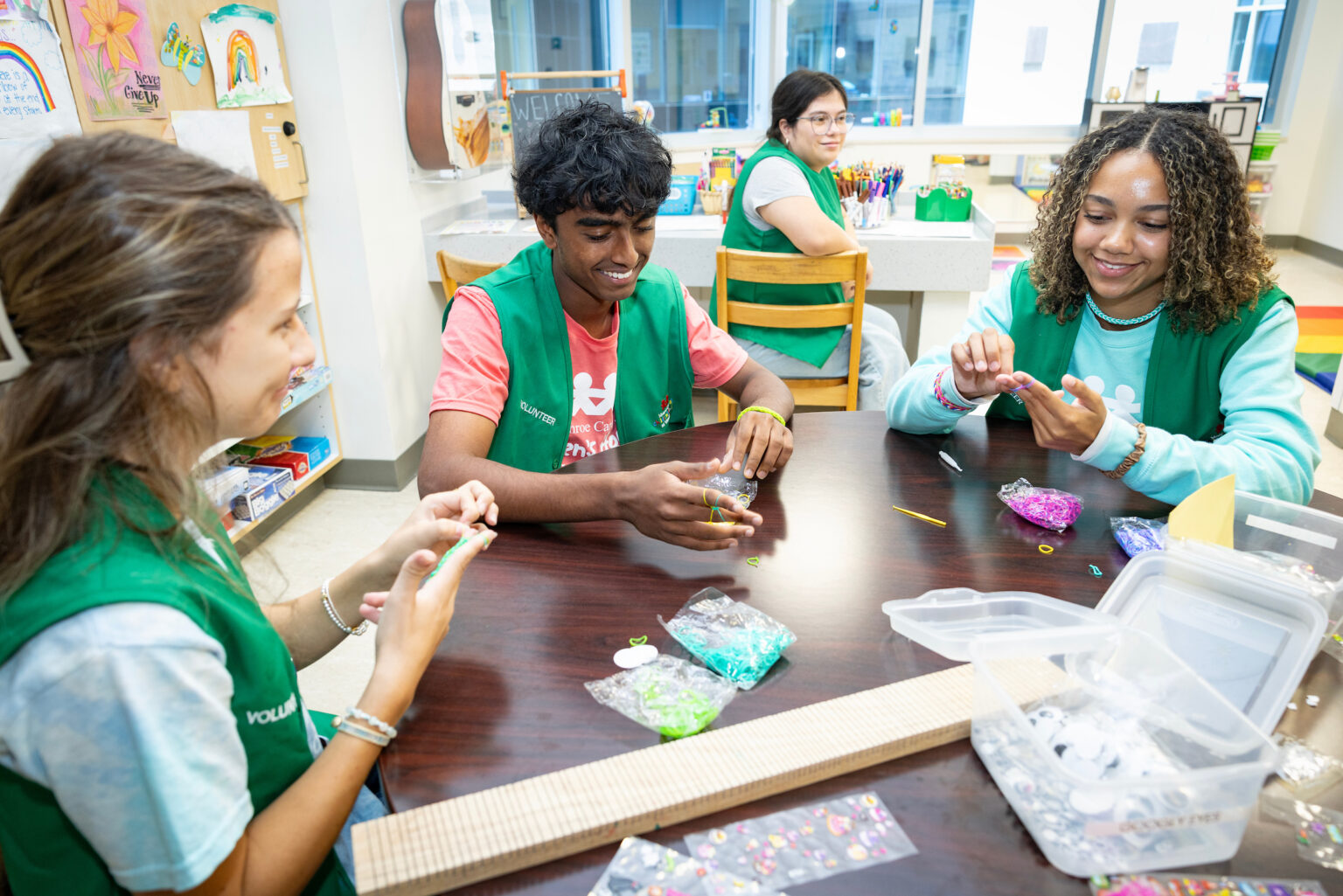Amilyn Turner, Milan Pavil and Olivia Anderson, volunteers with the STriVE volunteer program, make bracelets on, June 24, 2026, at Monroe Carell Jr. Children’s Hospital at Vanderbilt in Nashville, Tennessee.