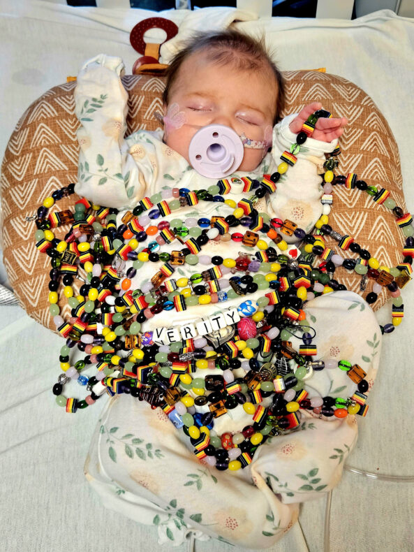 Patient Verity Vincenti wrapped in her beads of courage while at Monroe Carell Jr. Children's Hospital at Vanderbilt. 