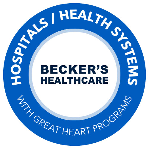 Circular blue-and-white logo reading “BECKER’S HEALTHCARE,” with “HOSPITALS | HEALTH SYSTEMS” around the top and “WITH GREAT HEART PROGRAMS” around the bottom.