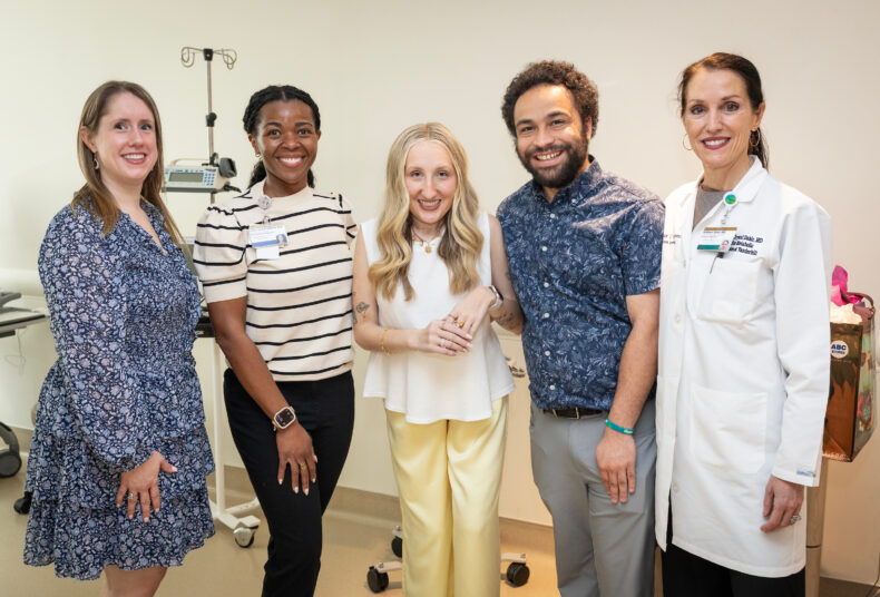 Jordyn Bugarin and her boyfriend, Jordan Thomas, together with her care team members Emily Shardelow, CCRP, left, LaToya Hannah, APRN-BC, MSN, and Kathryn Dahir, MD, right, during her final visit for the OPTIMA trial. She says finishing the study felt like a way to transform her experience into something meaningful for others. (photo by Erin O. Smith)