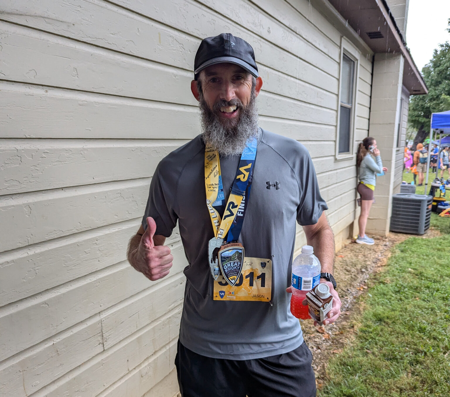 Jason Colee is all smiles after finishing the Great Smoky Mountains 16.2-mile challenge, one of several races he completed following surgery to remove a rare tumor from his spinal cord.