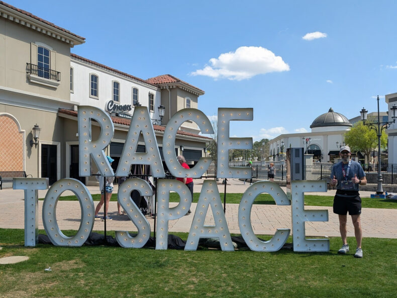 Jason Colee celebrates after completing the Race to Space Marathon, a milestone in the active life he worked hard to regain after wondering whether he would ever walk again.