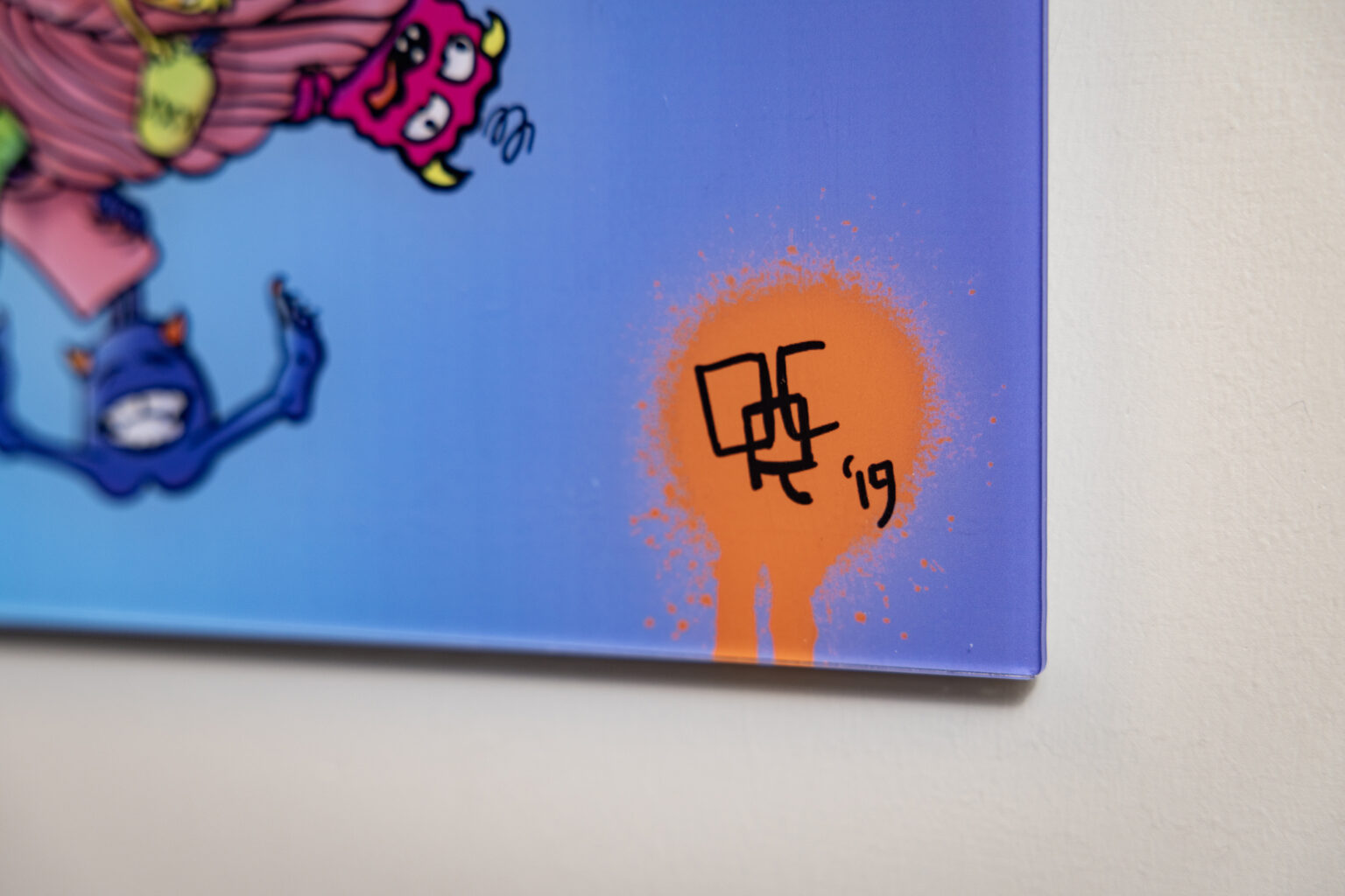 Curfman’s signature is in the bottom righthand corner of his artwork hanging from the walls of his office at The Vanderbilt Neurology Clinic. (photo by Erin O. Smith)