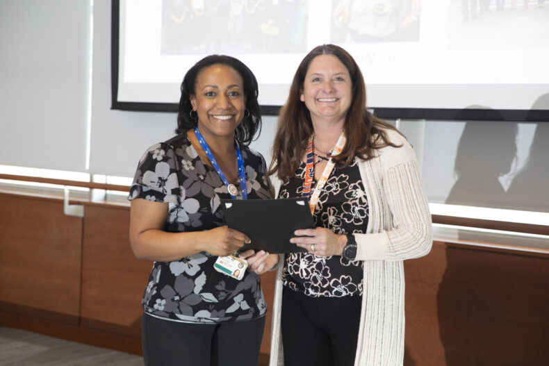 Jill Simmons, MD, right, with Erin Boyd, MD, at a reception for the new Fleming Scholars. (photo by Susan Urmy)