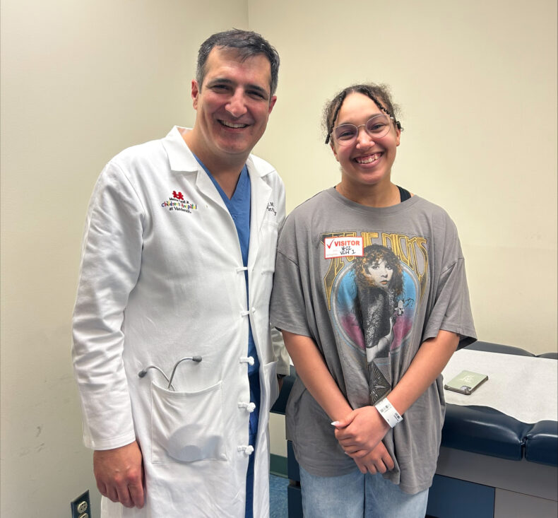 Zoe Forman with surgeon Carlos Mery, MD, MPH, during a follow up appointment.