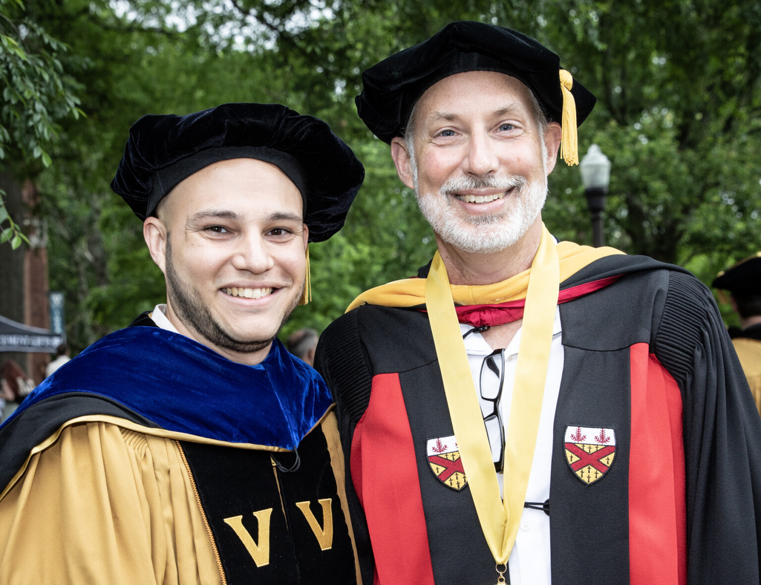 Gabriel José Rodriguez-Garcia, left, receiving his PhD in Molecular Pathology and Immunology, poses for a photo with his faculty advisor Jeffrey Rathmell, PhD. (photo by Erin O. Smith)