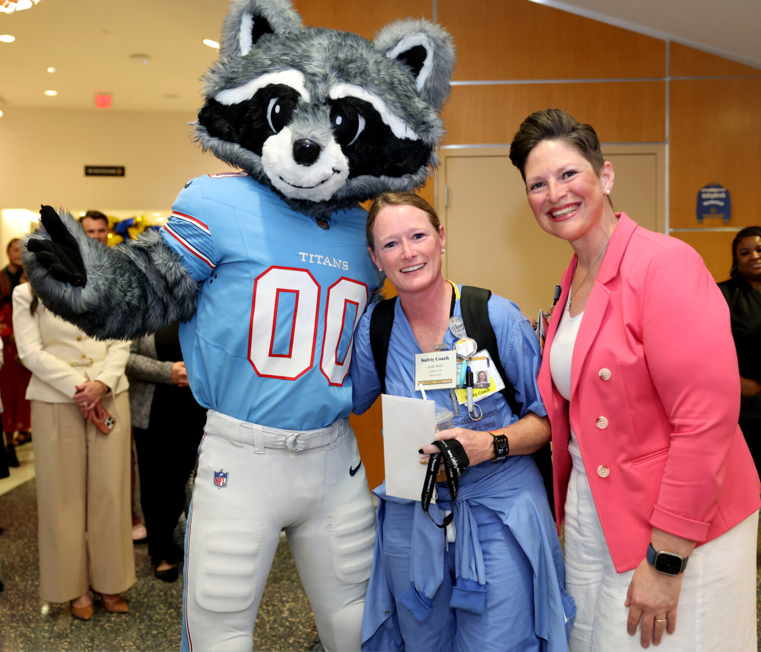 Safety Coach Leslie Hood, RN, center, with Jenny Slayton, RN, DNP, and Tennessee Titans mascot T-Rac. (photo by Donn Jones)
