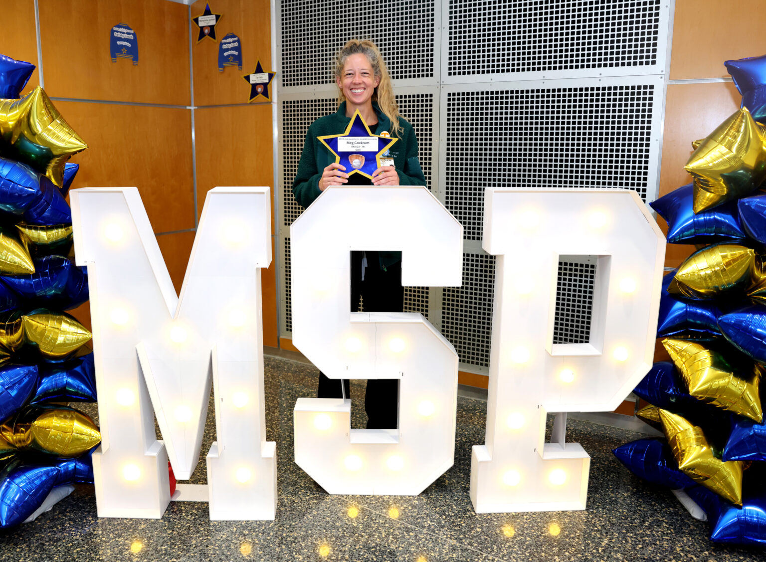 Meg Cockrum, RN, BSN poses for a photo with her star at the Making Safety Personal Celebration. (photo by Donn Jones)