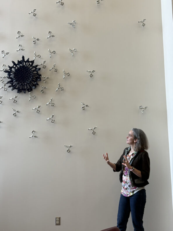 Briony Marshall describing her sculpture. (photo by Bill Snyder)