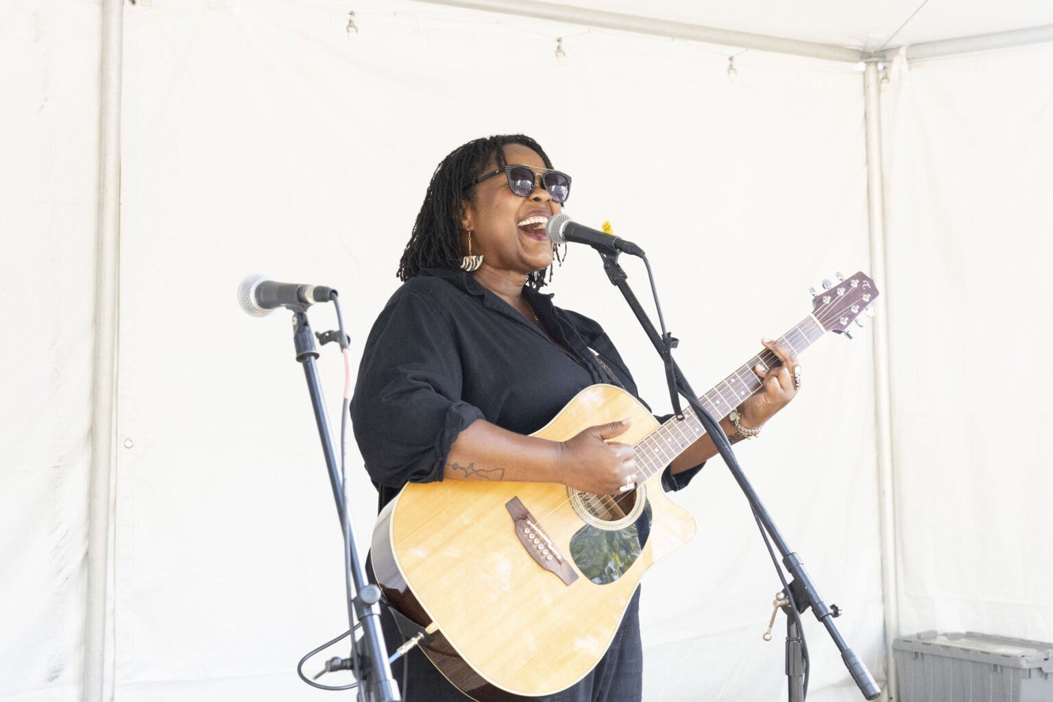 Musician Kyshona Armstrong sings and plays guitar at the Music Cognition Lab’s open house. (photo by Susan Urmy)