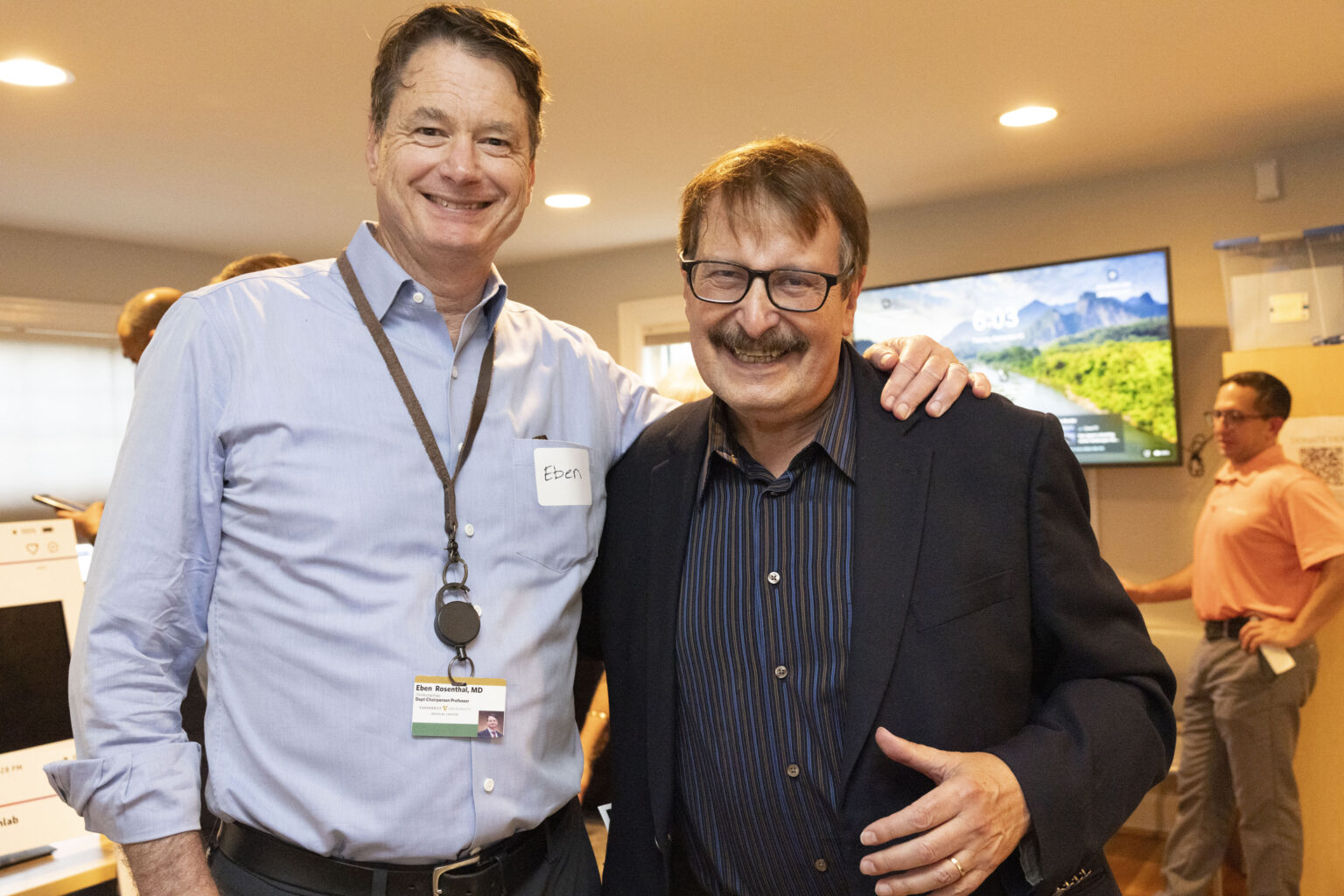 Past and present leadership meet as Eben Rosenthal, MD, Professor and Chair of the Department of Otolaryngology-Head and Neck Surgery (left) and Roland “Ron” Eavey, MD, Professor Emeritus and former Chair of the Department (right) pose for a photo. (photo by Susan Urmy)
