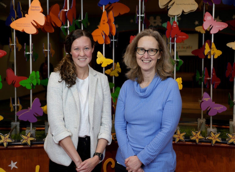 Maribeth Nicholson, MD, MPH, (left) and Borden Lacy, PhD, meeting here at the Hannah Dennison Butterfly Garden at Monroe Carell Jr. Children’s Hospital at Vanderbilt, have teamed up to improve the treatment of chronic C. diff infections. (photo by Donn Jones)