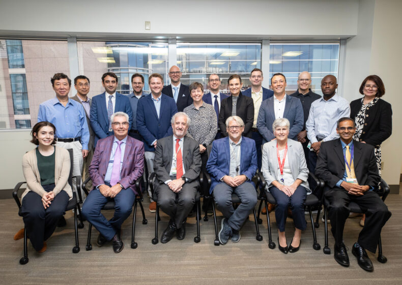 Dan Roden, MD, (seated, with red tie), with some of the many clinicians and scientists he has mentored during his career. (photo by Erin O. Smith)