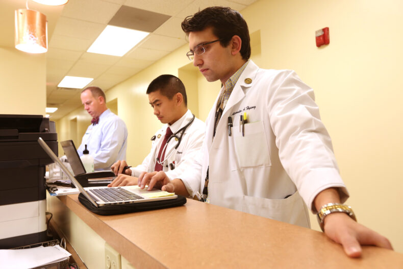 Medical students Stephen Chen and Alexander Hysong review their patients’ electronic health records using the same Epic system as the rest of the Vanderbilt Health system. (photo by Anne Rayner)