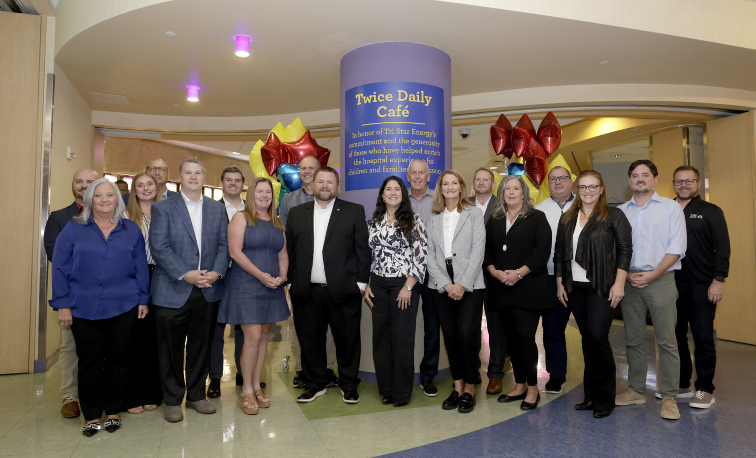 A group from Tri Star Energy celebrates the naming of the Twice Daily Café. (photo by Donn Jones)