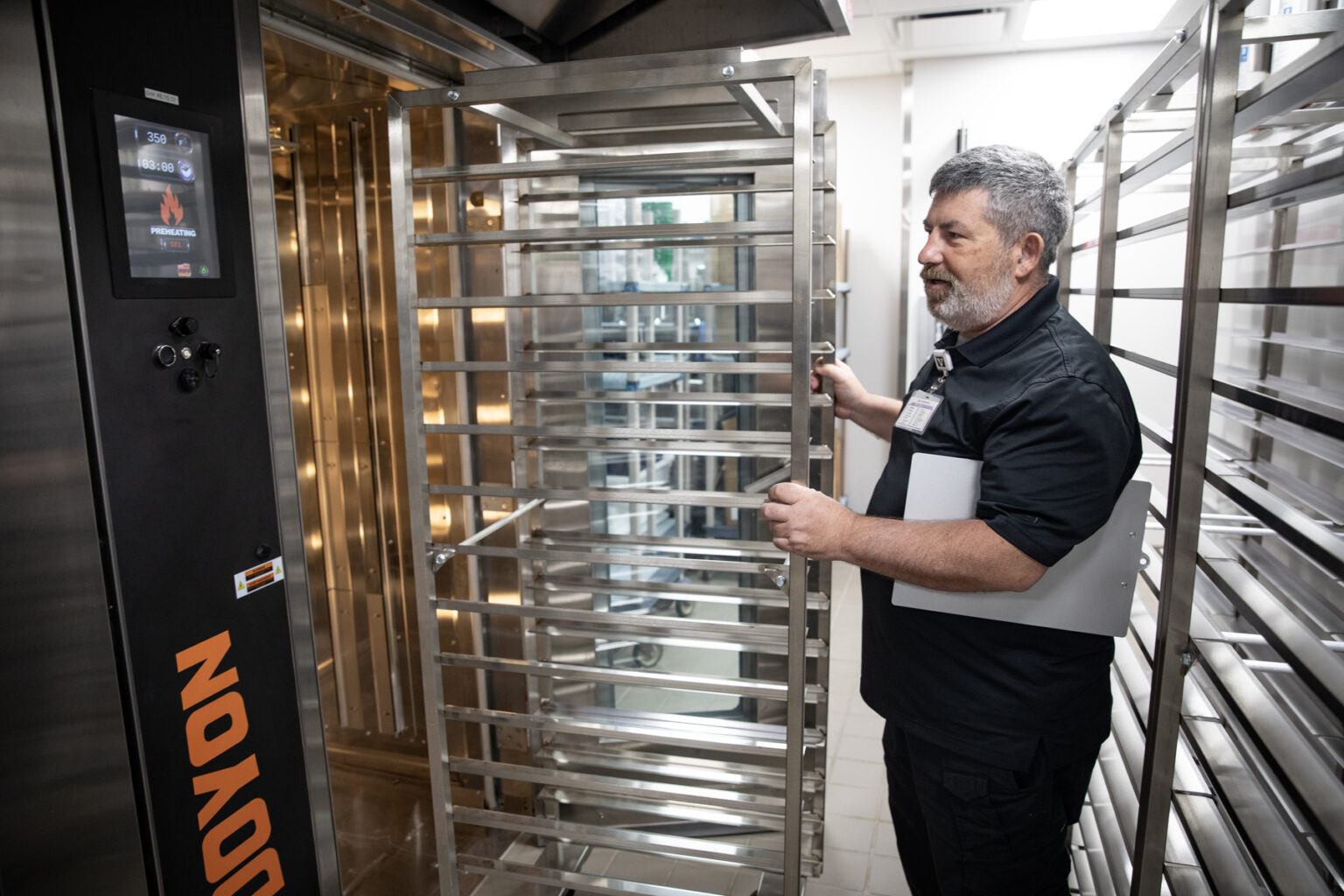 Calvin Spencer, an executive chef with Sodexo who works in the Vanderbilt University Hospital kitchen, speaks about the rotating commercial convection ovens in the renovated Vanderbilt University Hospital kitchen. (photo by Erin O. Smith)