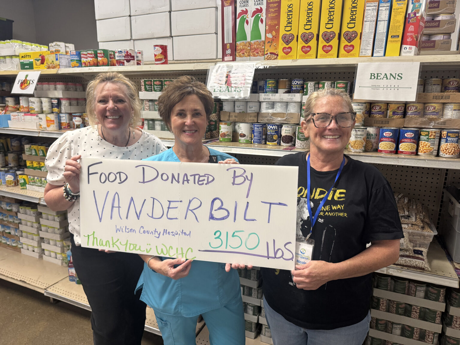 Teresa Shelton, Director of Case Management at VWCH, center, celebrates the results of the 