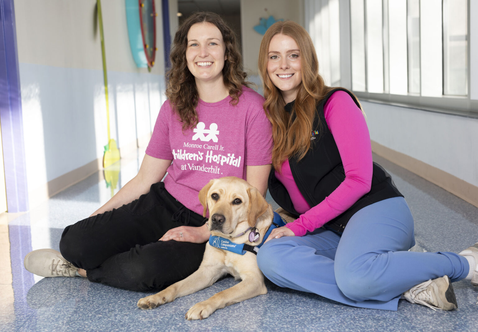 Facility dog Velour with Kaylor Glassman, MS, left, and Meredith George, MEd, CCLS. (photo by Susan Urmy)