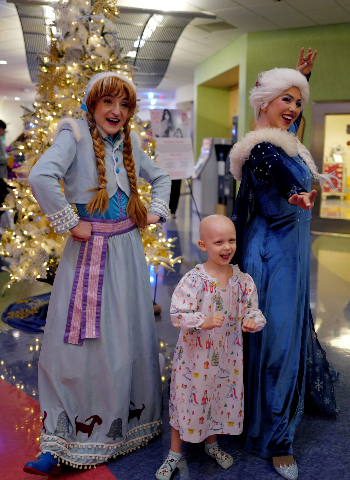 Hadley O'Harra, 4, with princess characters Elsa and Anna. (photo by Donn Jones)