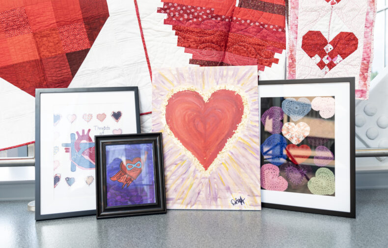 "Heart Art" created in a crafting support group is photographed on the 6th floor skybridge. (photo by Erin O. Smith)
