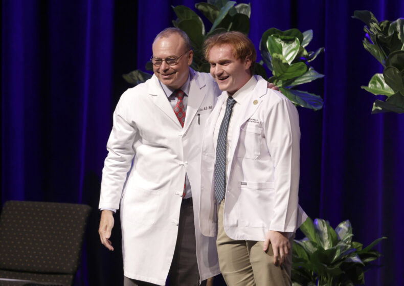 First-year medical student Ryan Herzog of Kingsport, Tennessee, right, poses for a photo with Jeff Balser, MD, PhD. (photo by Donn Jones)