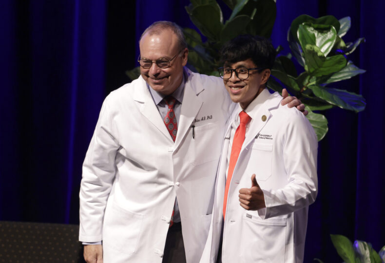 Edward Duong of Branson, Missouri, right, poses for a photo with Jeff Balser, MD, PhD. (photo by Donn Jones)