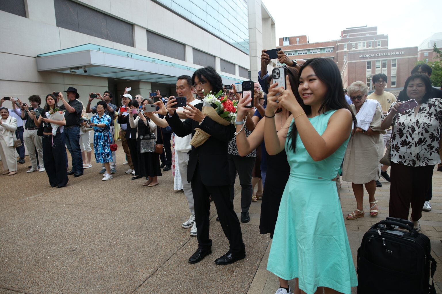 Proud family and friends snap photos of the Class of 2030 following the ceremony.