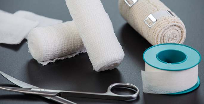 Medical bandages with scissors and sticking plaster