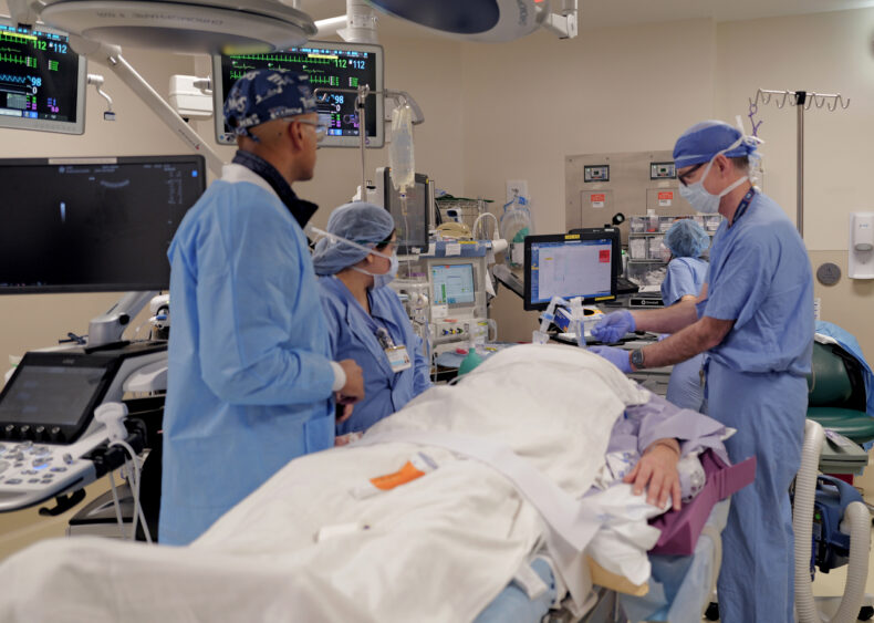 Sekhar Padmanabhan, MD, looks on as the surgical team prepares to begin the procedure. (photo by Donn Jones)